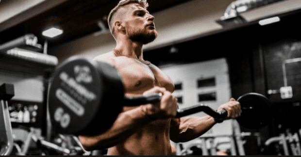 Athlete lifting a barbell in the gym